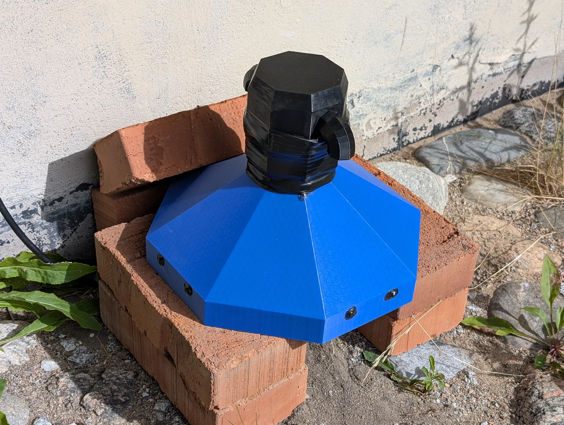 The more robust octagonal sensor house elevated on bricks