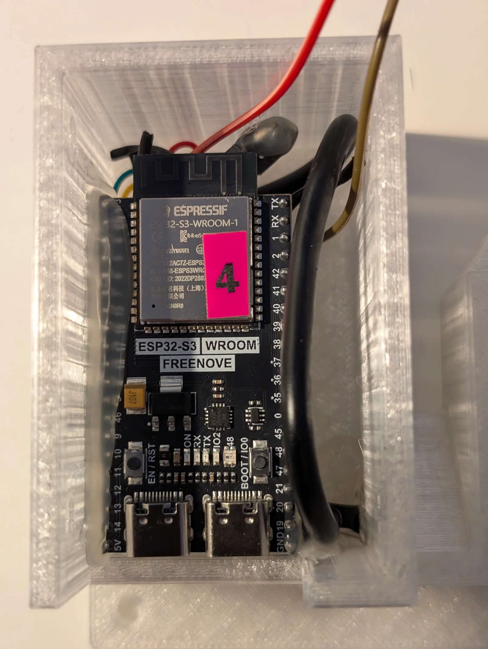 Inside unit 4: a Freenove ESP32-S3-WROOM-1 board fitted in the translucent enclosure, with wiring routed beside it